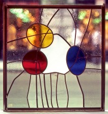 Autonomous stained glass: "Primary", 1.5' by 1.5', location unknown.