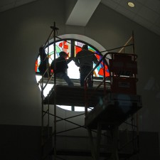 Installation of West Window, "Reach Out" stained glass window.