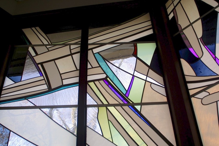 Glass version of a straw St. Bridget Cross in Reconciliation Chapel.
