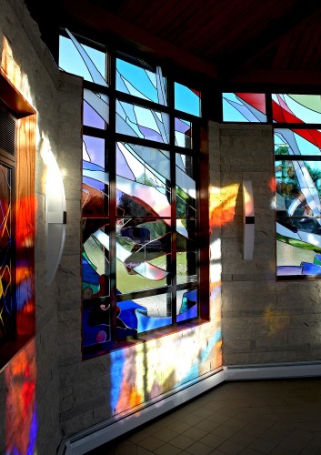 East Window bathed in color from other windows at sunset.