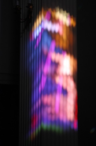 Color projections onto fluted column.