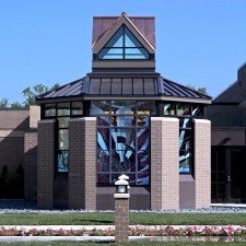 Exterior, daytime view showing reflective German opal glass in stained glass windows.