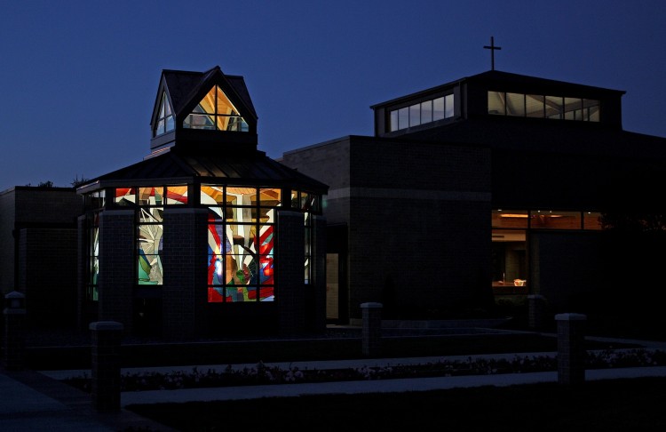 Chapel at night with main sanctuary at right.