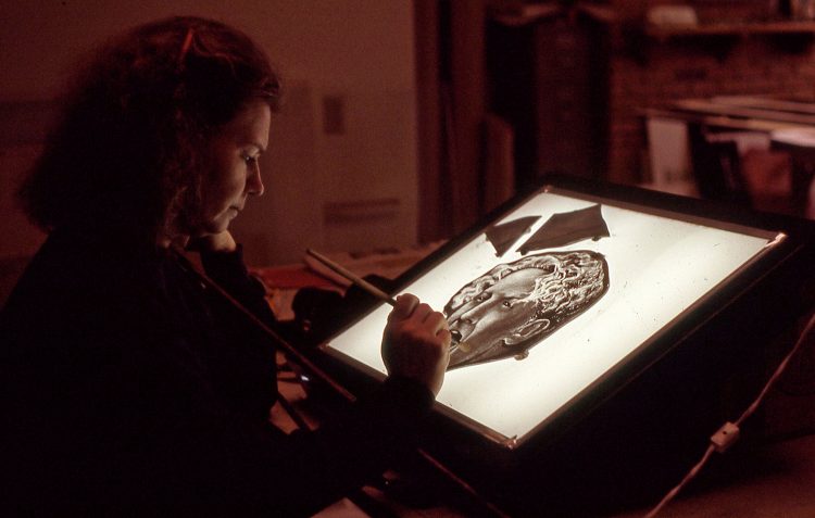PAINTING: Ellen Soderquist creates shading on the glass blank silkscreened with her Jerry Lee Lewis portrait.
