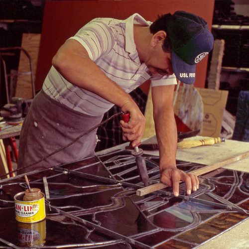 SOLDERING & BRACING: Greg Cortinas solders steel bracing to back of Jerry Lee Window.