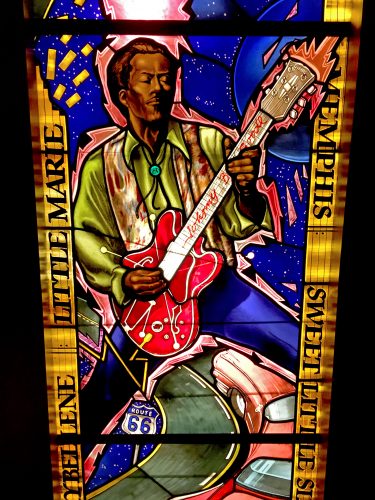 Chuck Berry playing his cherry red Gibson over Route 66 & his pink Cadillac. (at the Moth)
