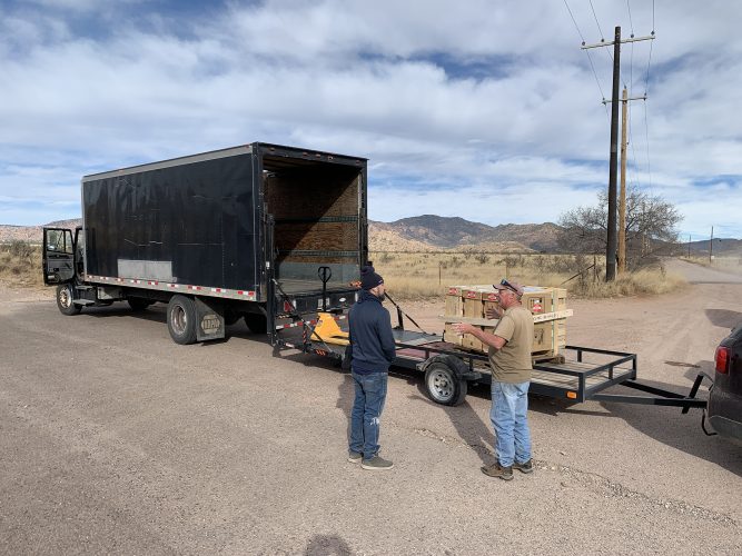 Neighbors came to watch as the three crates totaling 1,547 pounds were delivered as far as pavement would allow... The final leg of their journey still lies ahead. . .