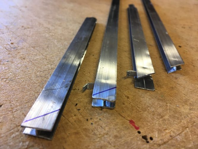 Think of lead calme as tiny I-beams into whose grooves the edges of the glass fits. Lead is a soft metal that can be easily bent to shape. At intersections with other lead, the ends must be trimmed for a clean, gapless fit.

This photo follows the process. First the 
