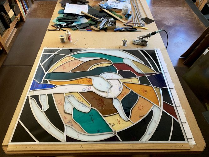 . . . Keeping the unsoldered glass and lead snug and tight while building a panel of stained glass results in a more rigid, stronger panel. This panel is now ready to be soldered.