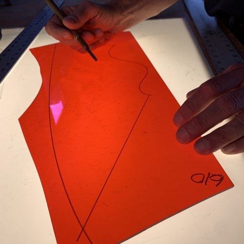 GLASS CUTTING: Here a  hypothetical pattern shape has been traced onto a larger sheet of glass. It's time to start cutting. . .