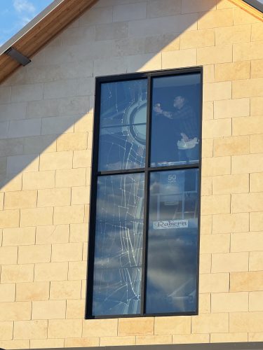 Outside view of the partially installed South Window being prepared for its remaining stained glass. For further details click on 