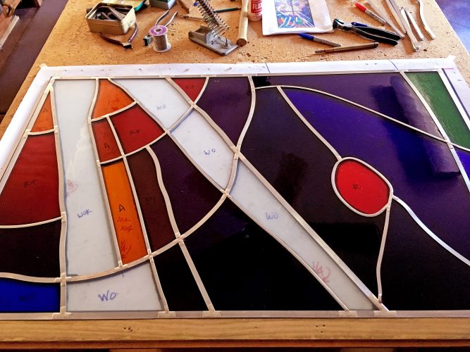 Soldering is complete on one of the 20 panels that comprise the Narthex Window.